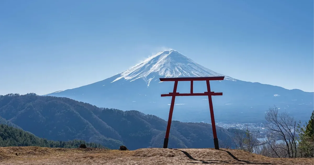 The Tenku-no-Torii hilltop gate above Kawaguchi Asama Shrine with Mount Fuji directly behind it